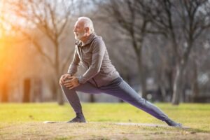 Senior man with energy exercising stretching