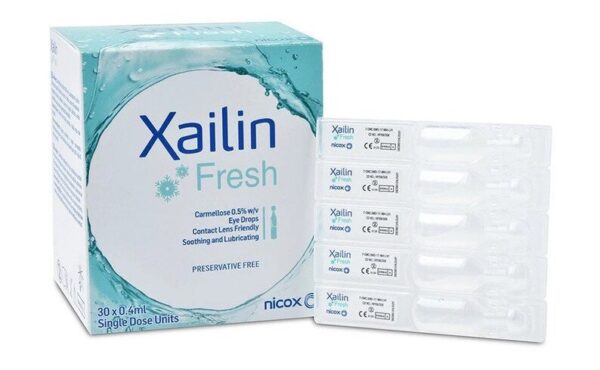 Image of Xailin Fresh Eye Drops packaging and single-dose units. The packaging displays the product name "Xailin Fresh" with the description "Carmellose 0.5% w/v Eye Drops. Contact Lens Friendly. Soothing and Lubricating. Preservative Free." The box contains 30 x 0.4 ml single-dose units, which are visible alongside the packaging. The manufacturer's logo "Nicox" is also present on the box and single-dose units.